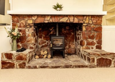 Wood burning stove and Devon stone fireplace in lounge